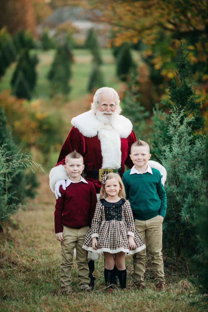 Santa with kids at the tree farm