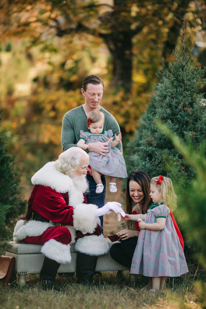 Santa with family at the tree farm
